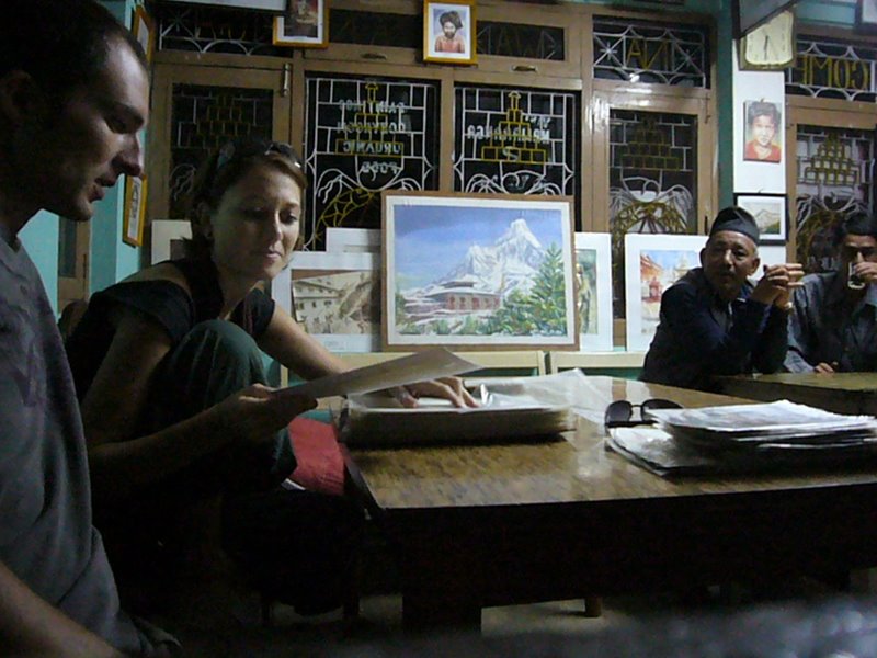 Purna shows us a large collection of local art, all of which is for sale.